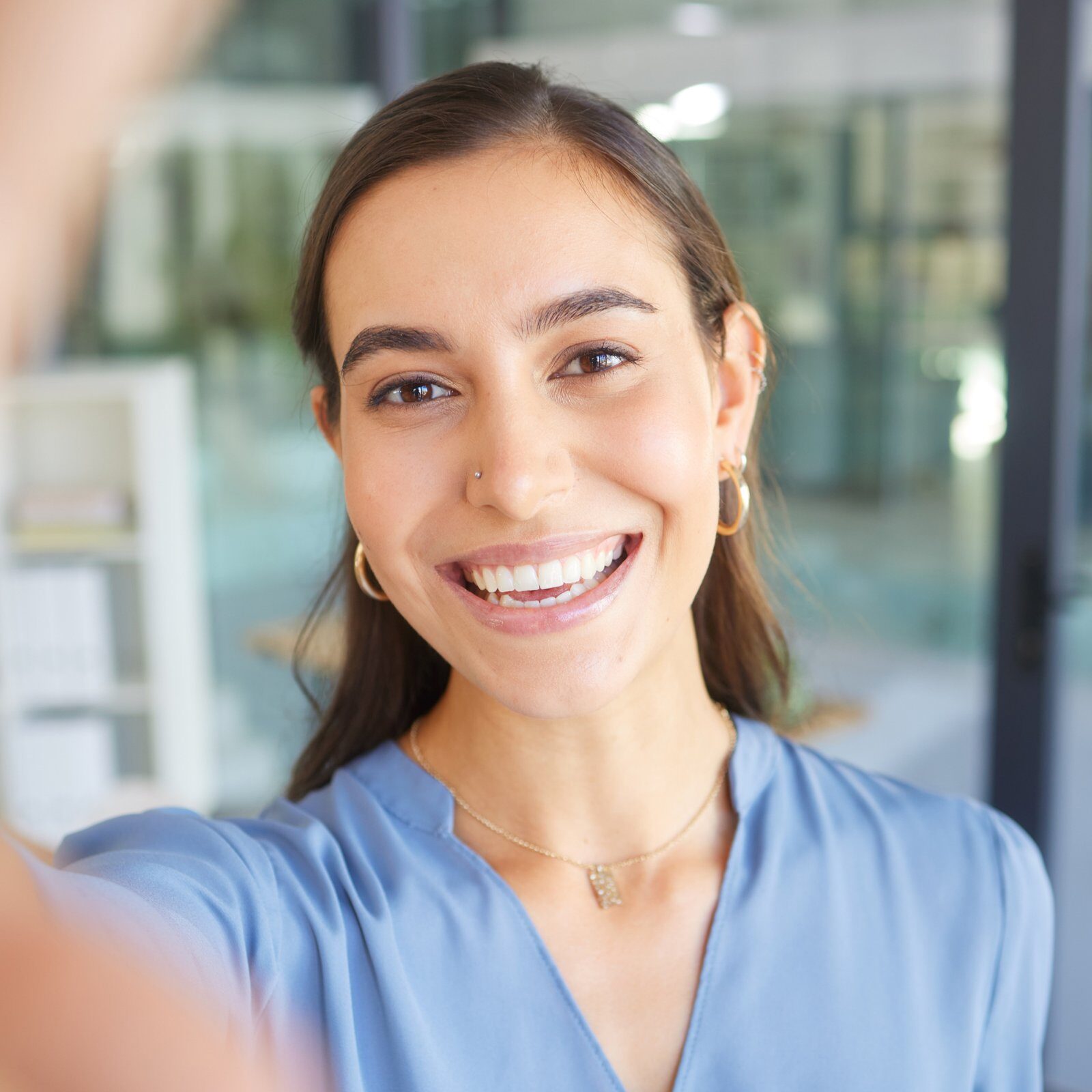happy-portrait-or-business-woman-taking-a-selfie-in-office-building-for-a-social-media-profile-pic